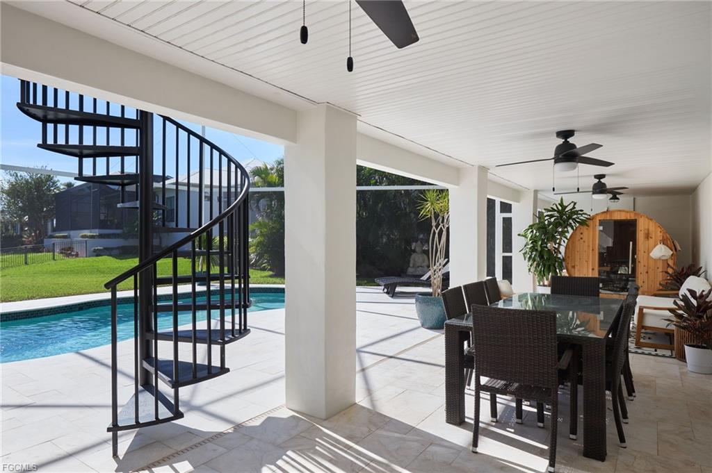 Two-story screened lanai with cedar sauna and outdoor dining